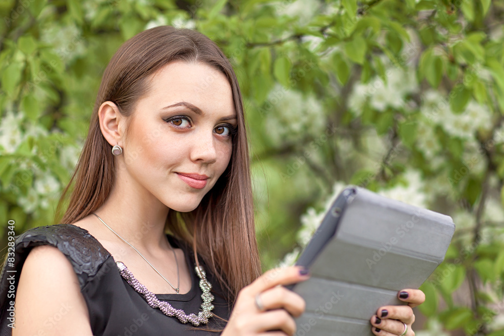 Young woman with digital tablet