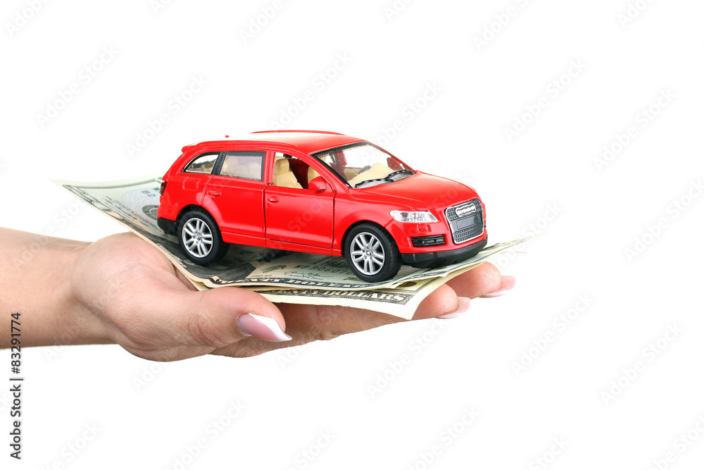 car with cash in female hand isolated on white background