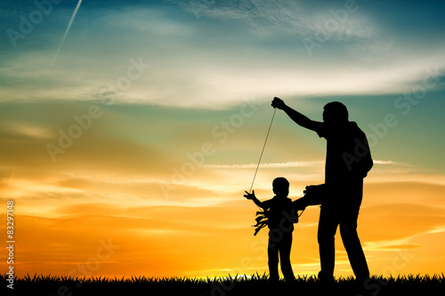 father and son with kite