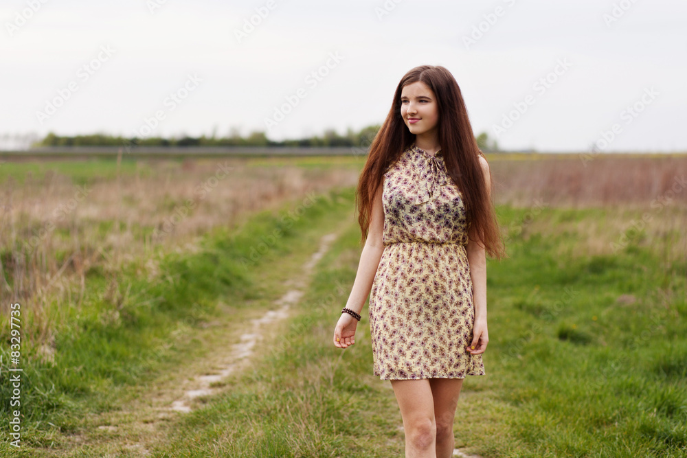 Young beautiful woman in the fields