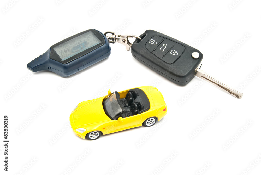 Fototapeta premium yellow car and keys with alarm