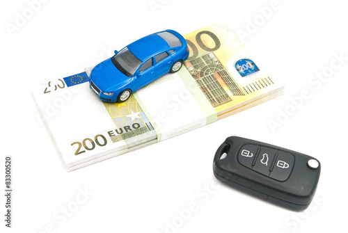 keys, blue car and banknotes
