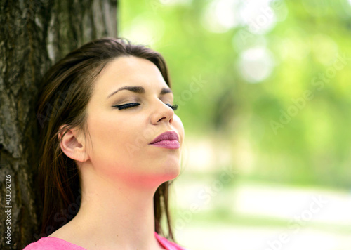 Spring woman enjoying nature on a beautiful summer day