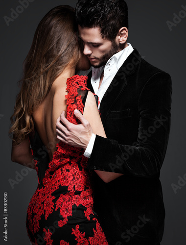 Fashion photo of sexy elegant couple in the tender passion