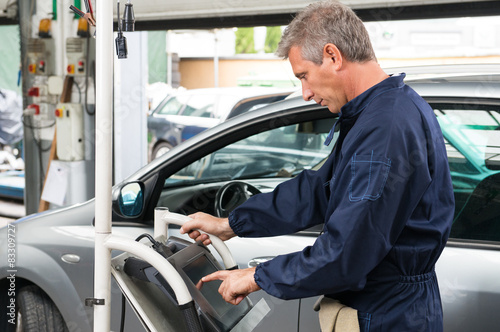 Mechanic Working At Control Unit