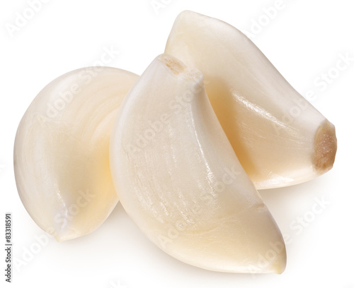 Peeled garlic cloves isolated on a white background.