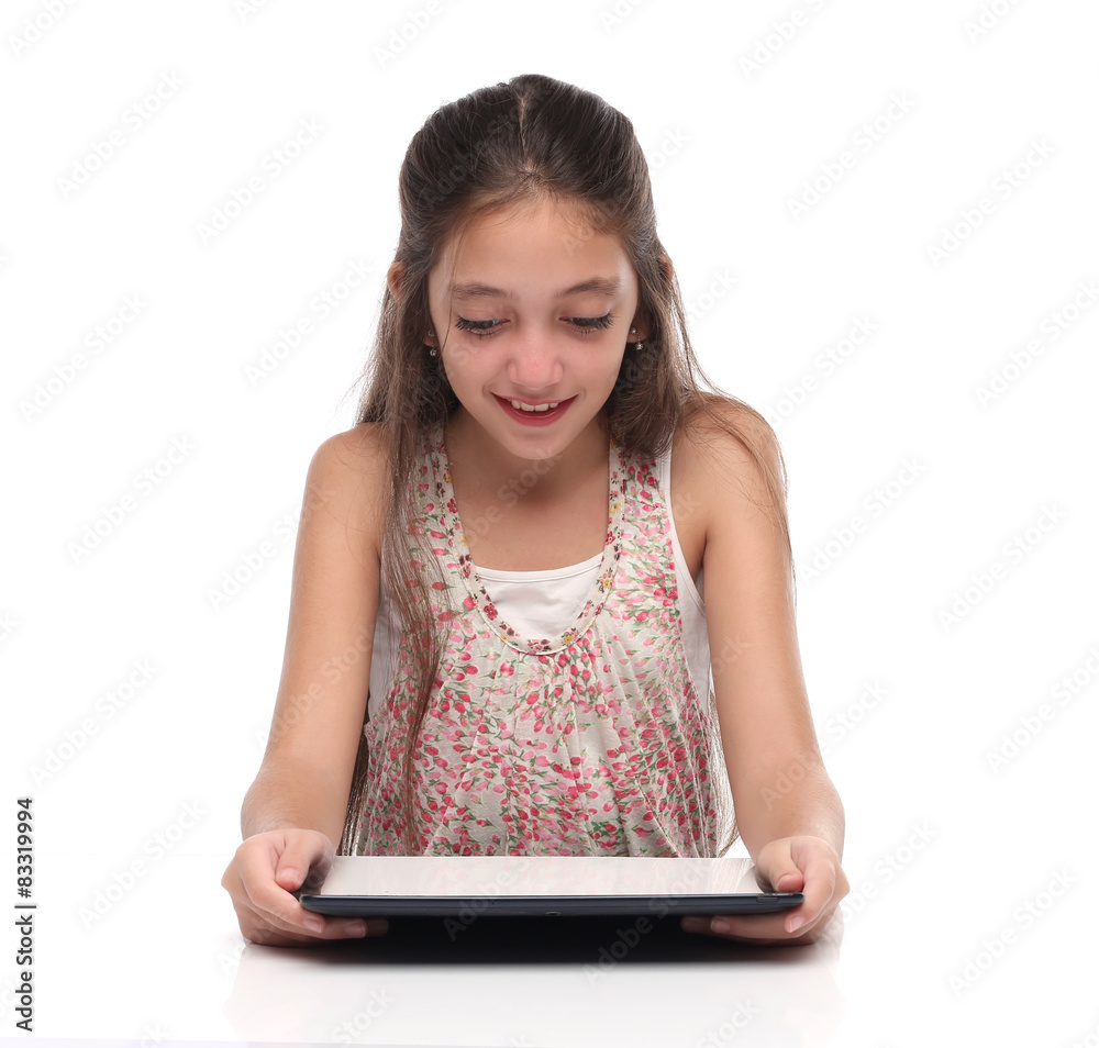 Beautiful pre-teen girl with a tablet computer. Isolated. Beautiful pre-teen girl with a tablet computer. Isolated.