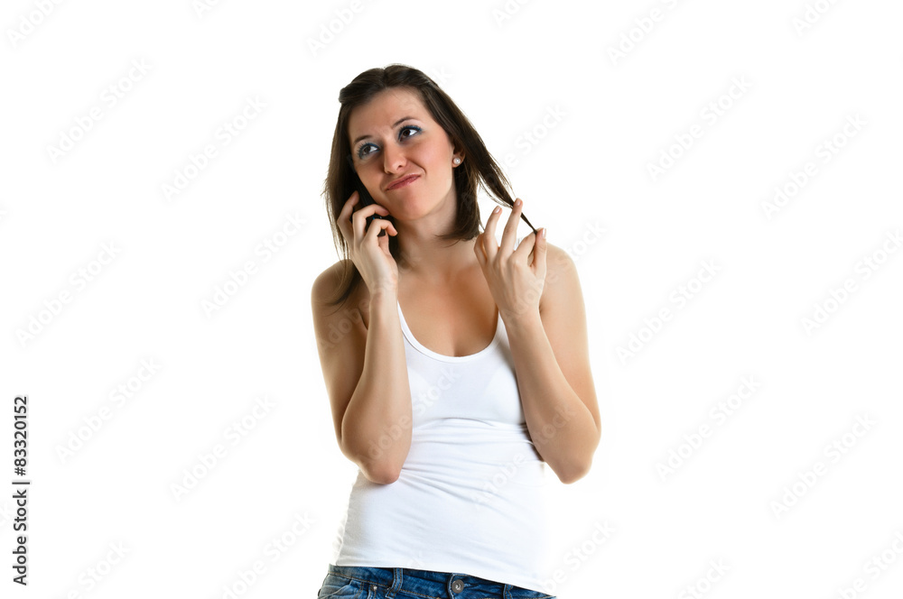 Beautiful young woman with white top talking to the phone Beautiful young woman with white top talking to the phone