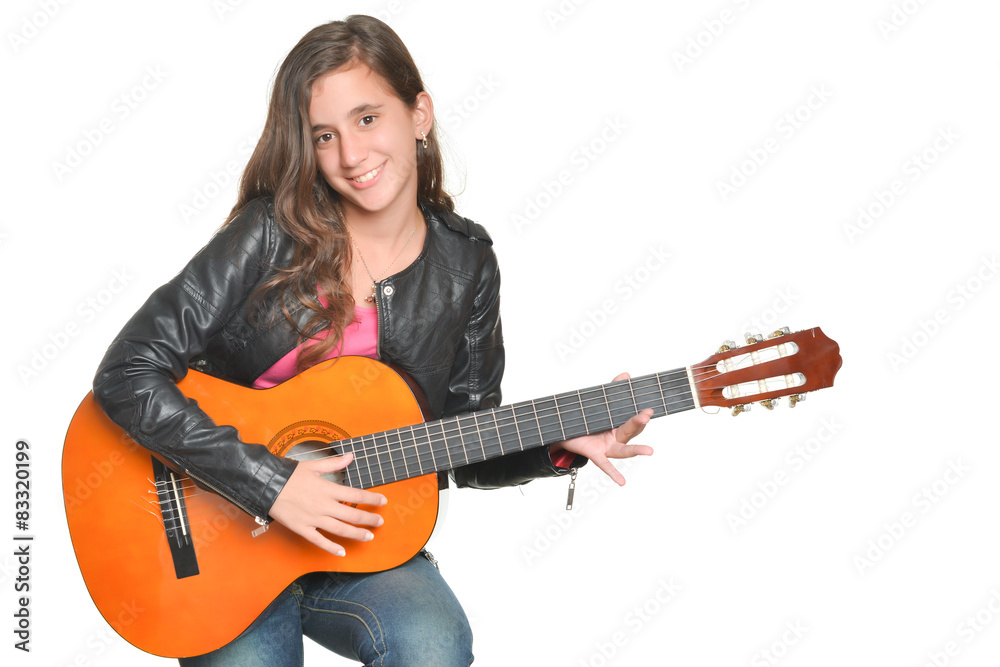Trendy hispanic teenage girl playing an acoustic guitar Trendy hispanic teenage girl playing an acoustic guitar