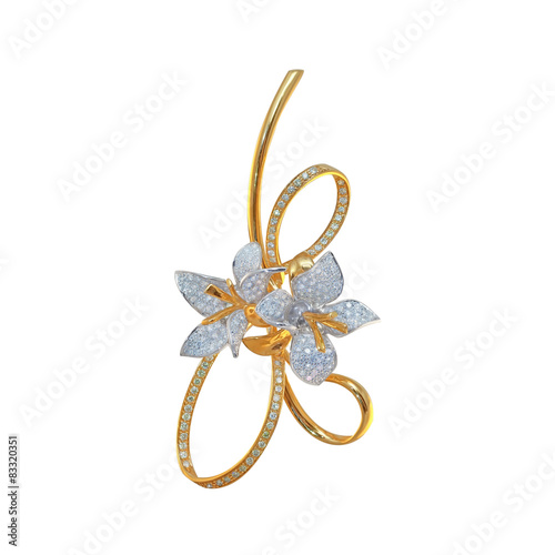 golden brooch with diamonds on a white
