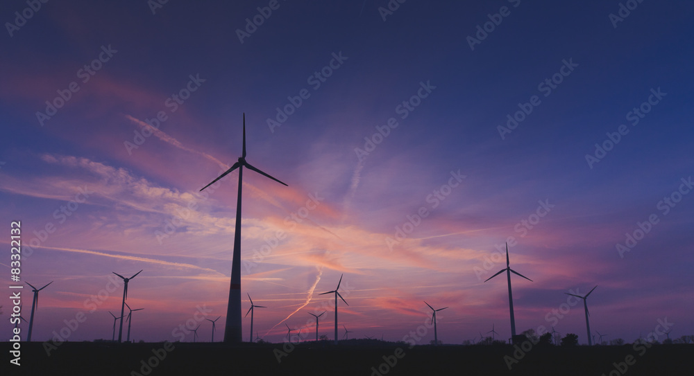 Obraz premium Sunset with Windgenerator