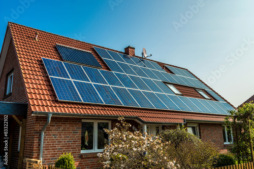 Obraz na płótnie Solar panel on a red roof