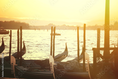 Beautiful sundusk in Venice with gondolas photo