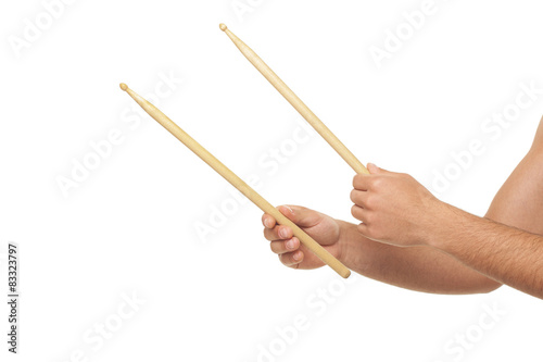 Male hands holding drum sticks.isolated backgrund 