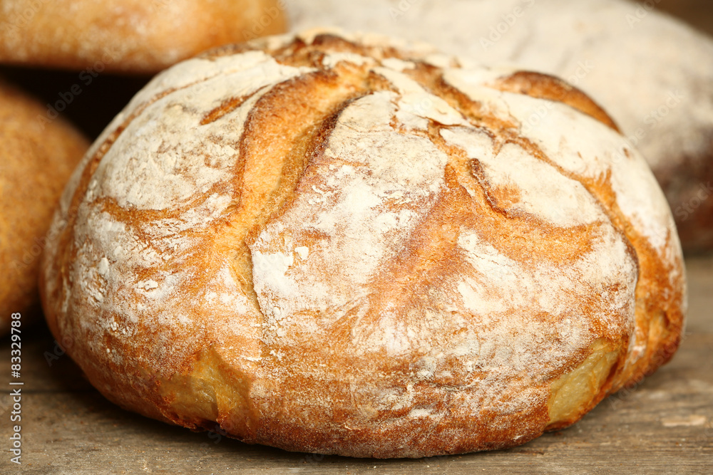 Different fresh bread on old wooden table Different fresh bread on old wooden table