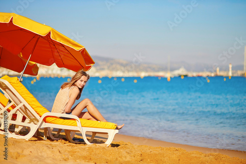 Beautiful girl relaxing on a beach chair © Ekaterina Pokrovsky