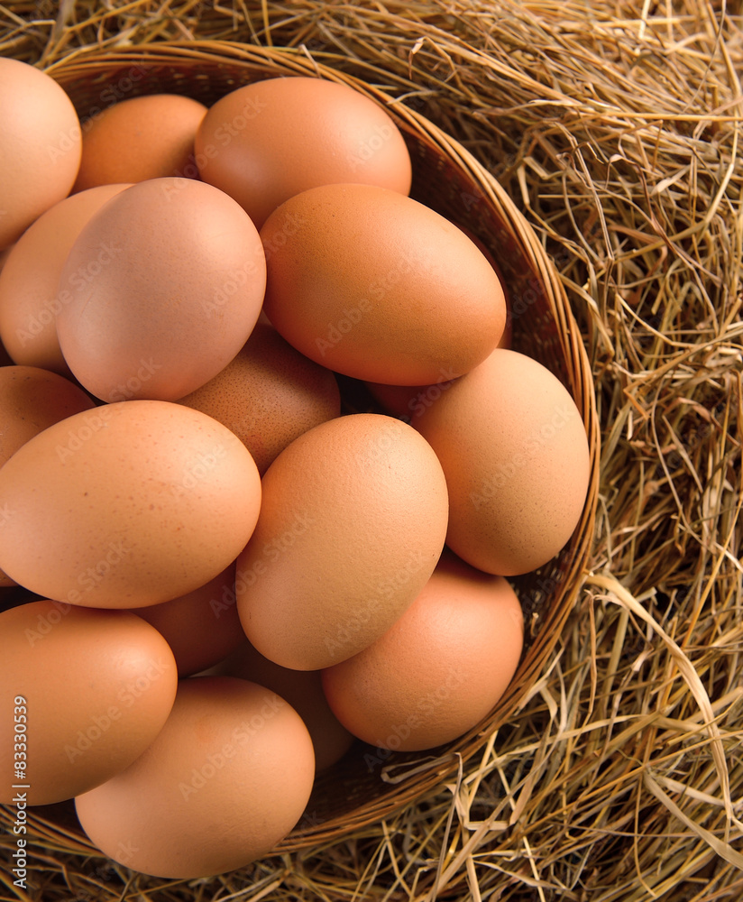 egg in a basket on the dried grass egg in a basket on the dried grass