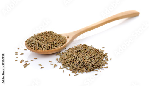caraway thai herbs spices in the wood spoon on a white backgroun