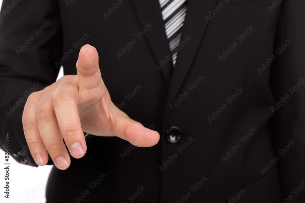 Business man touching an imaginary screen against white backgrou