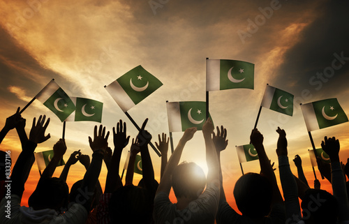 Φωτογραφία Group of People Waving Flag of Pakistan in Back Lit