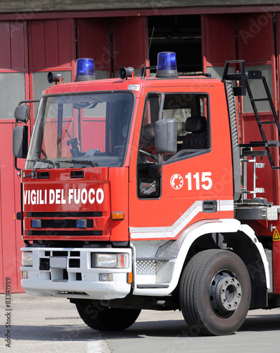 Italian fire trucks with lettering and blue sirens