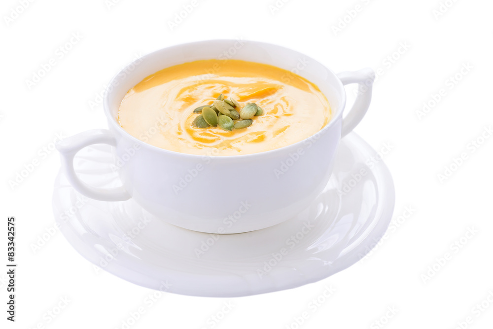 Pumpkin cream soup in bowl on white background Pumpkin cream soup in bowl on white background
