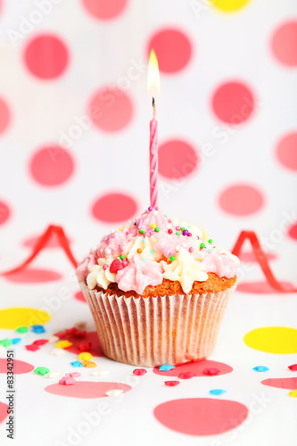 Birthday cupcake with butter cream and candle 