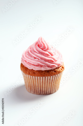 Birthday cupcake with butter cream on white background