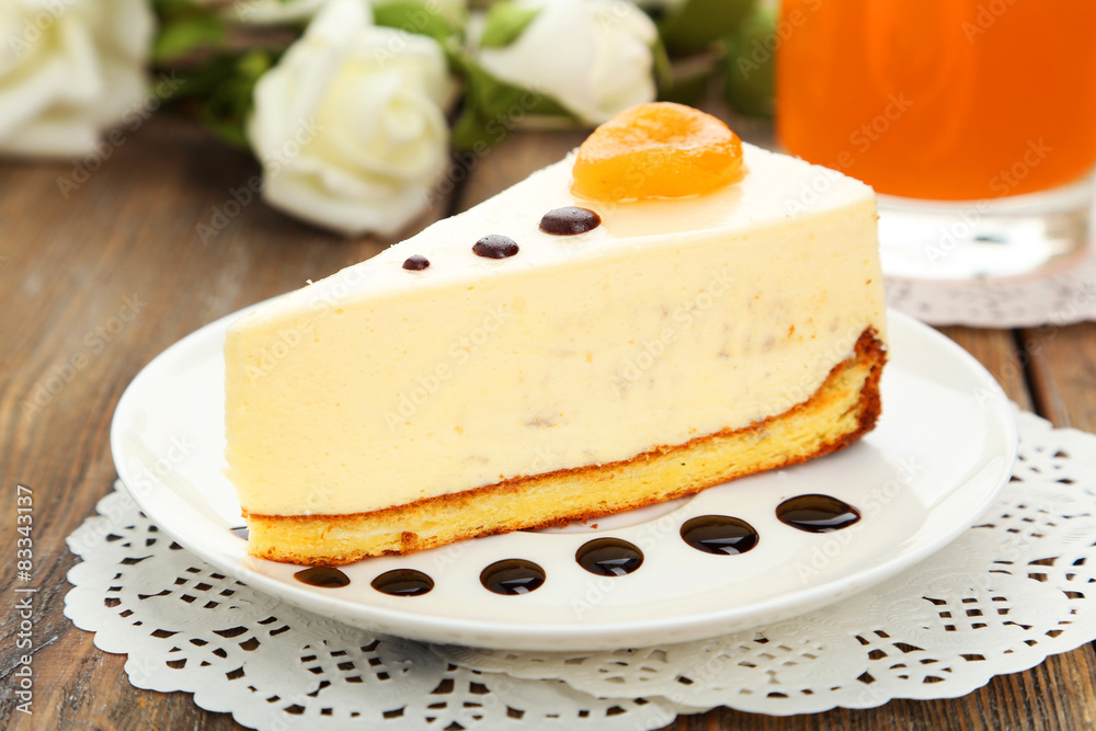 Cheesecake on the plate on brown wooden background