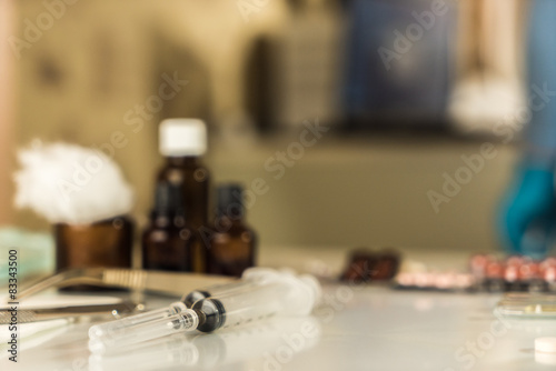 Syringe with glass vials and medications pills drug