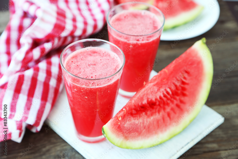 Watermelon smoothies on brown wooden background Watermelon smoothies on brown wooden background