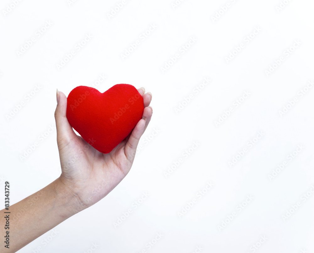 Hand holding red heart with space on white background