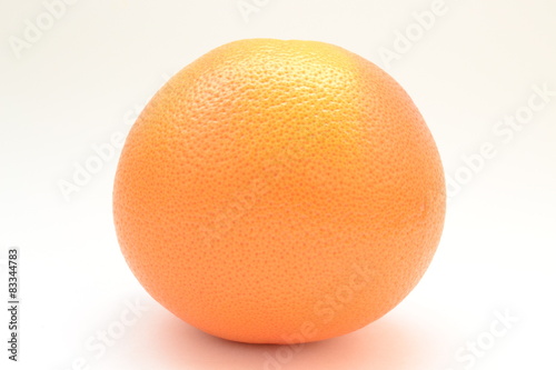 Red grapefruit on a white background on the table