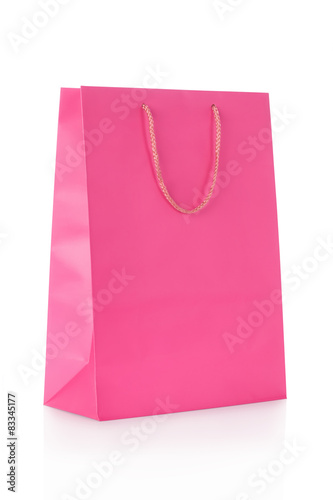 Pink shopping bag in paper on white, clipping path