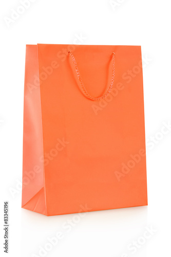 Orange shopping bag in paper on white, clipping path