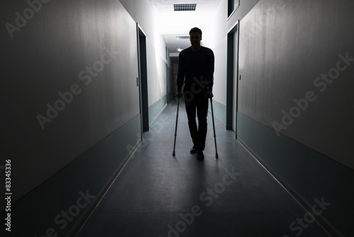 Slika na platnu Man Walking With Crutches