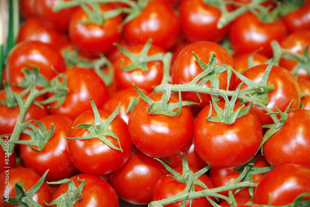 Fresh red tomatoes as a background