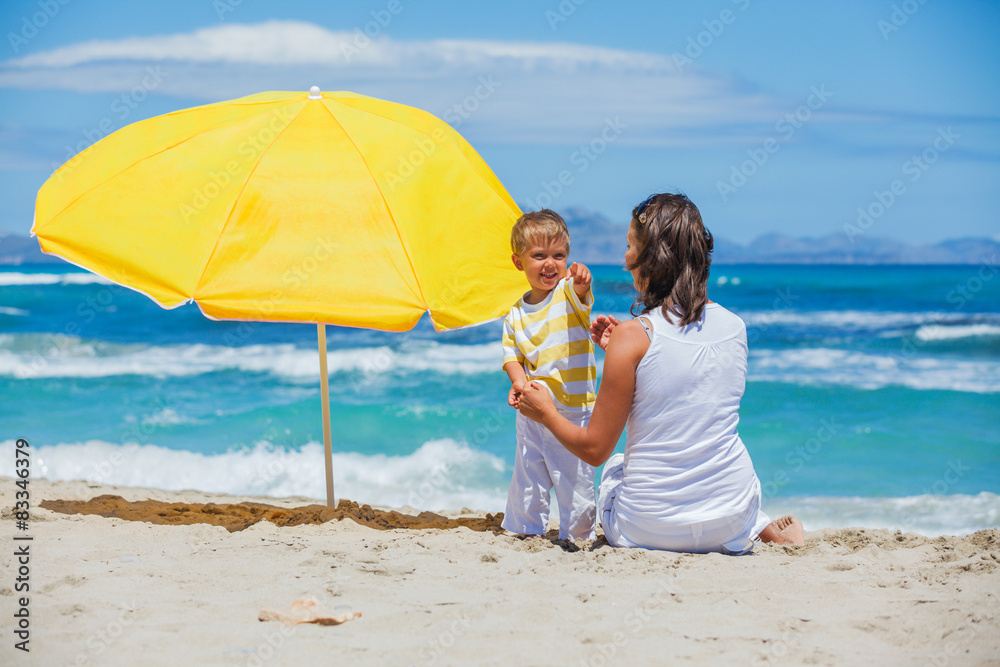 Mother with son on beach