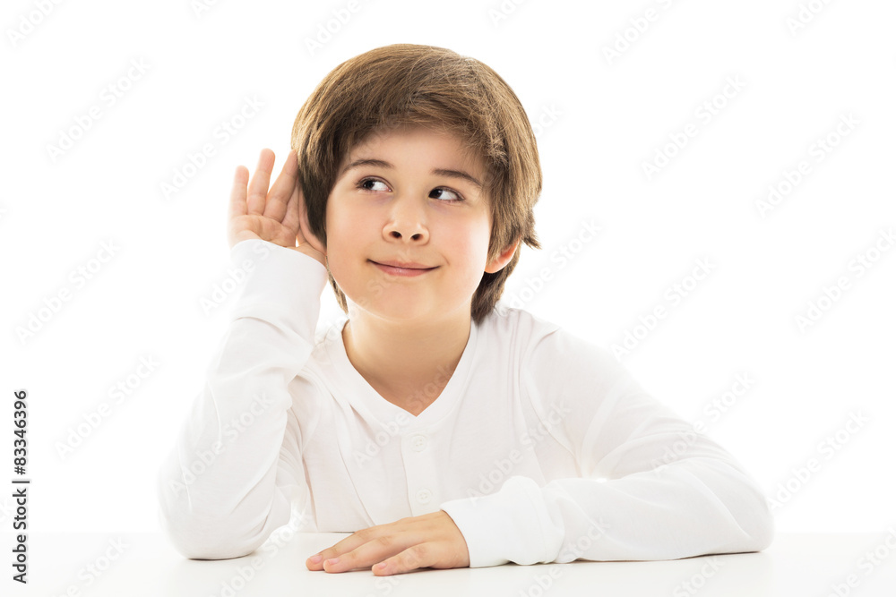 Boy with a hand to ear in a listening gesture
Boy with a hand to ear in a listening gesture