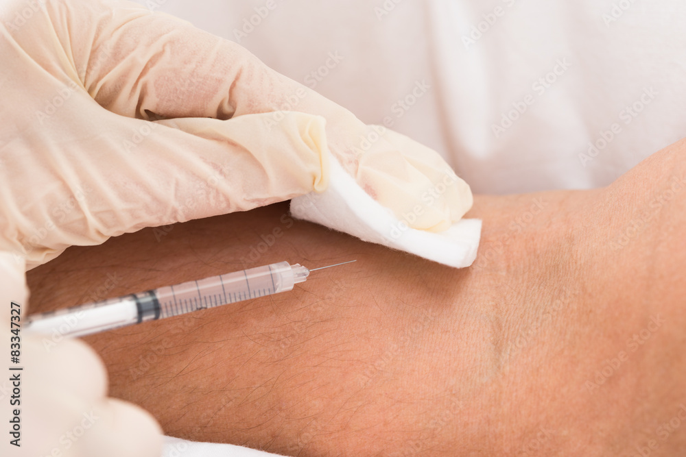 Doctor Injecting Vaccine To Patient Doctor Injecting Vaccine To Patient