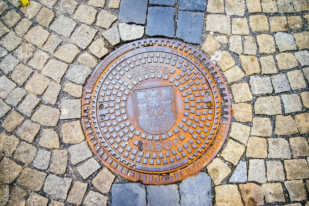 Hatch of sewage on the paving road