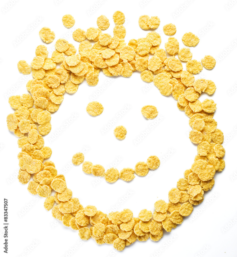 Obraz premium Cornflakes arranged as smiley face on a white background.