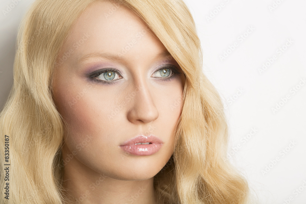 Portrait of a beautiful woman with curly blond hair Portrait of a beautiful woman with curly blond hair