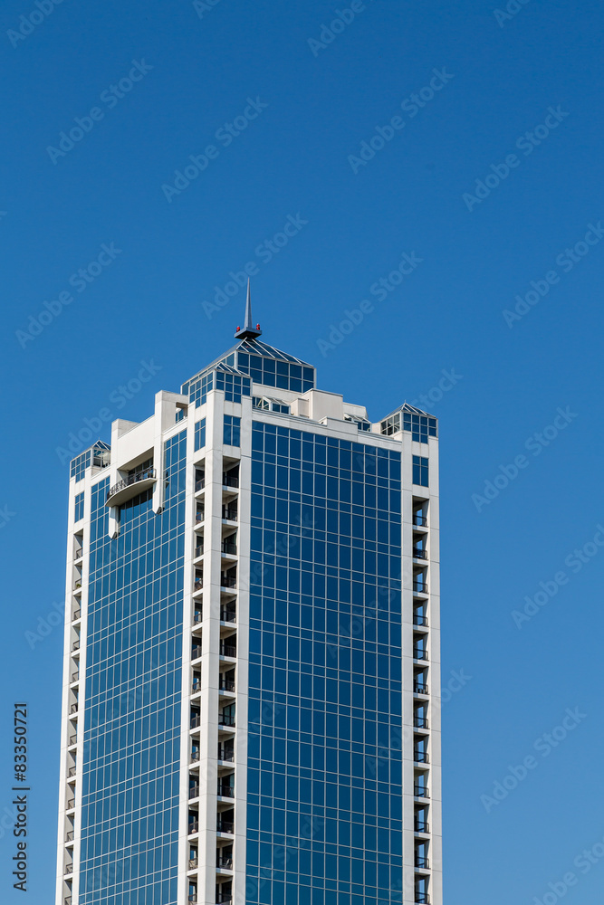 Fototapeta premium Blue Glass Office Tower with White Stone Corners