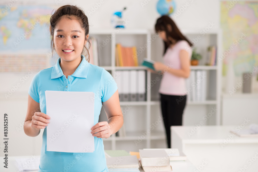 Schoolgirl with blank sheet of paper Schoolgirl with blank sheet of paper