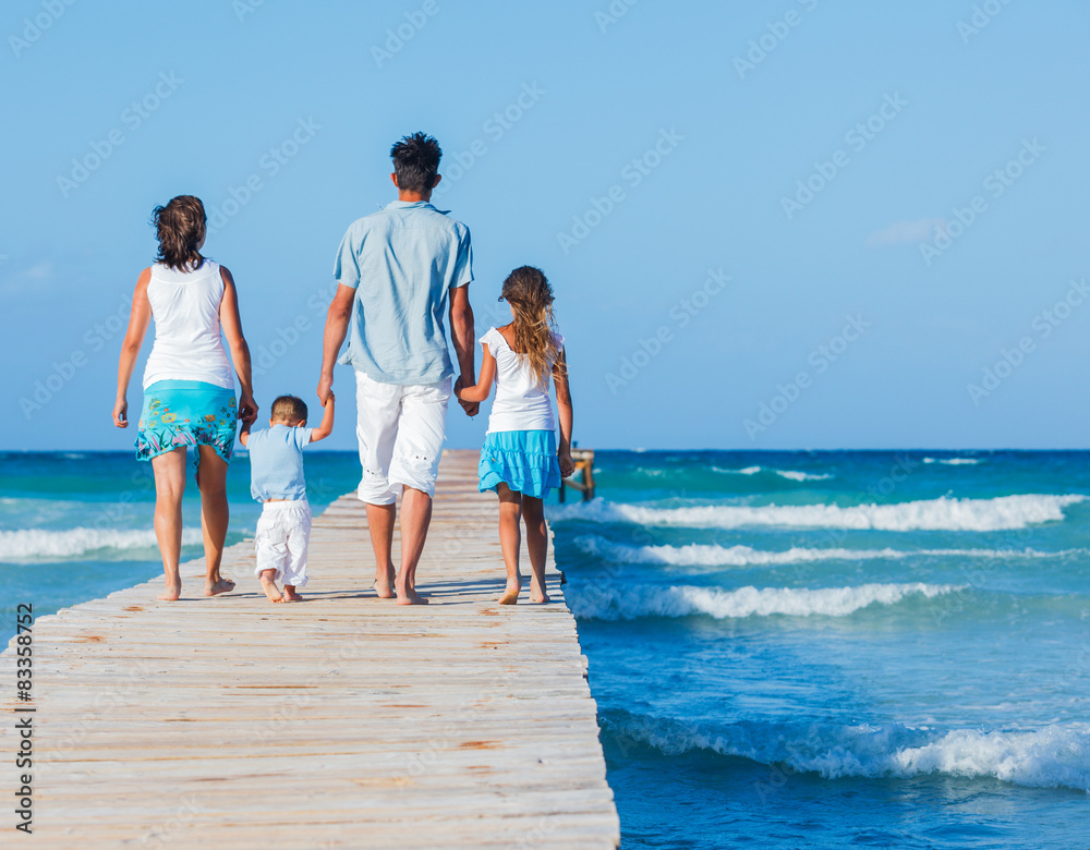 Family walking wooden jetty