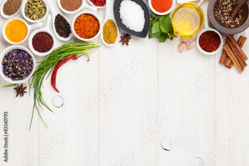 Fototapeta Naklejka Na Ścianę i Meble -  Various spices on white wooden background