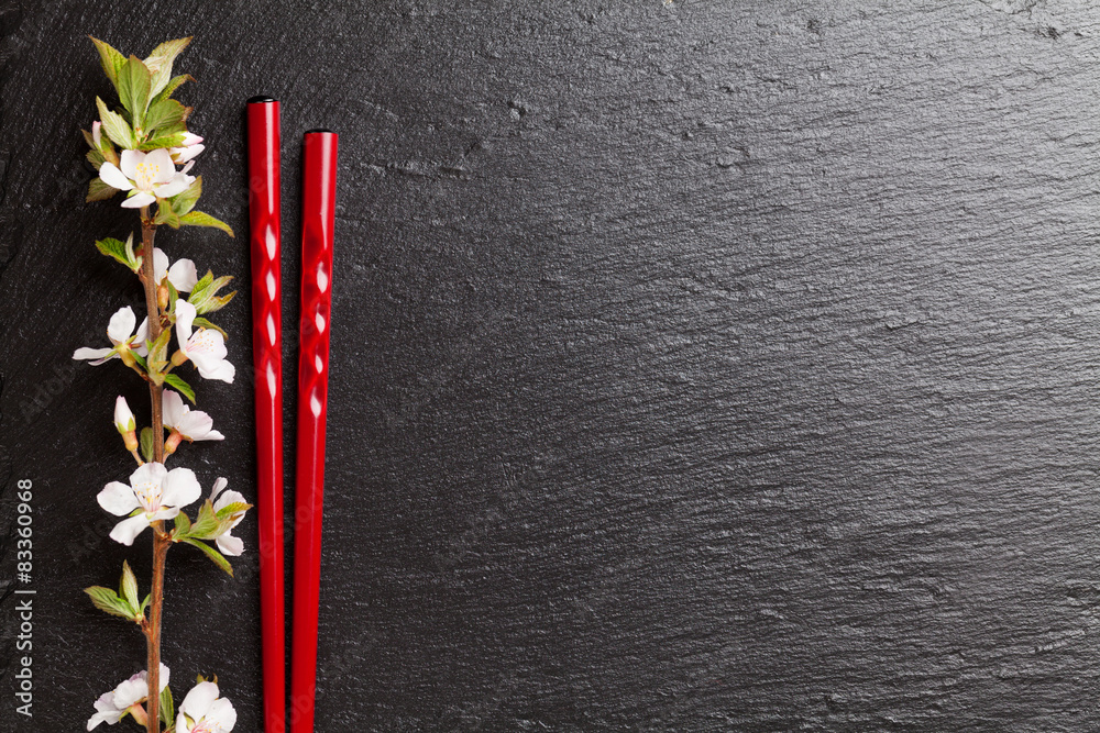 Japanese sushi chopsticks and sakura blossom Japanese sushi chopsticks and sakura blossom