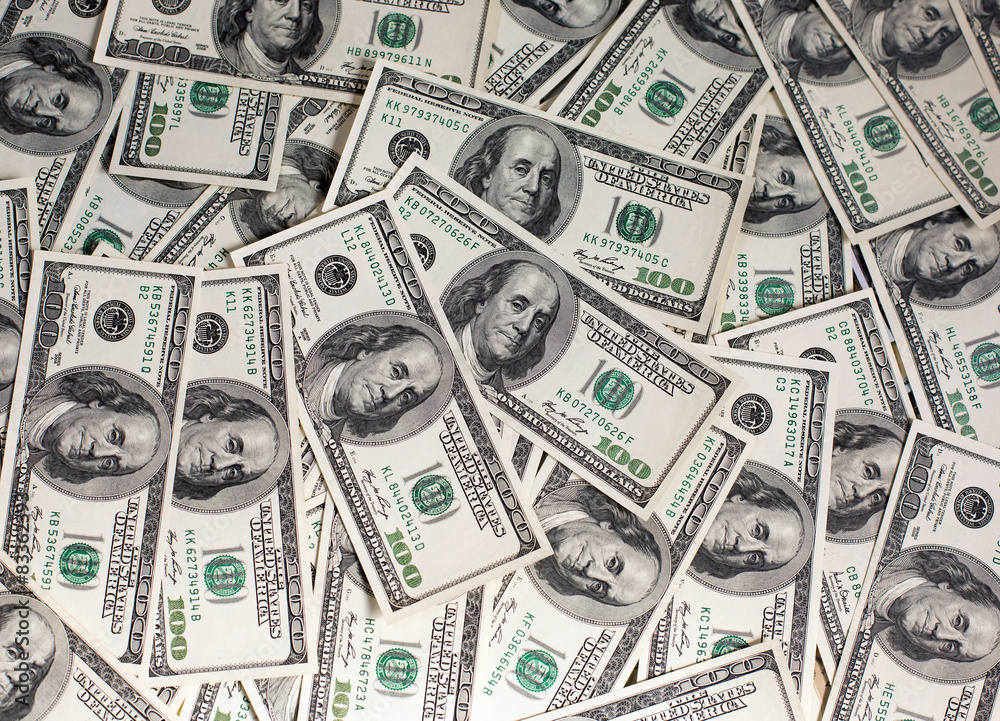 A pile of one hundred dollar bills A pile of one hundred dollar bills