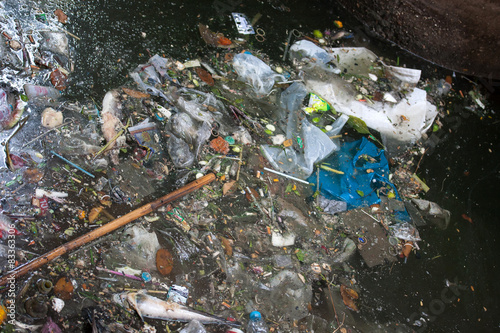 Garbage piling up at a flooded street during the monsoon season
